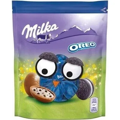 Млечен шоколад с млечен пълнеж и парчета какаови бисквити - Milka